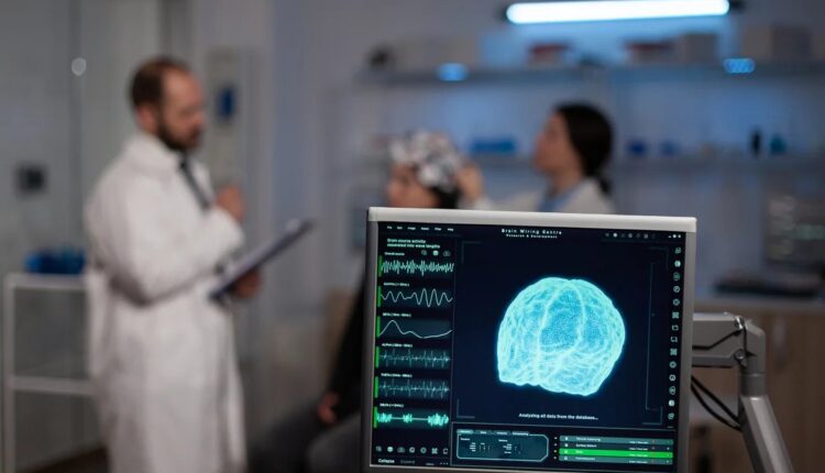 Médicos acompanham sinais cerebrais em monitor durante teste